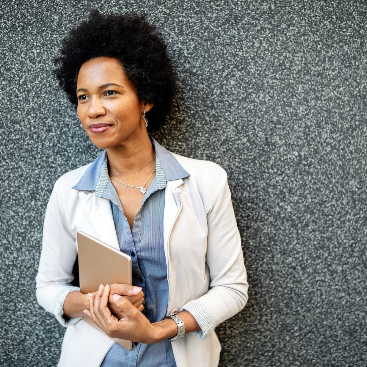 urban-happy-business-woman-using-tablet-computer-and-working